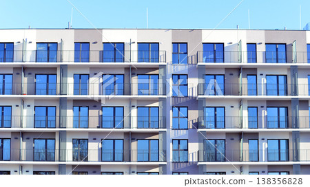 Apartments in residential complex. Housing structure at modern house. Architecture for property investment. and architecture details. Urban abstract - windows of apartment building. Apartments in residential complex. Housing structure at modern house. Architecture for property investment. and architecture details. Urban abstract - windows of apartment building. 138356828