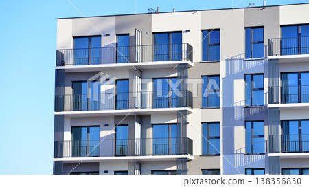 Apartments in residential complex. Housing structure at modern house.  Architecture for property investment. and architecture details. Urban abstract - windows of apartment building. 138356830