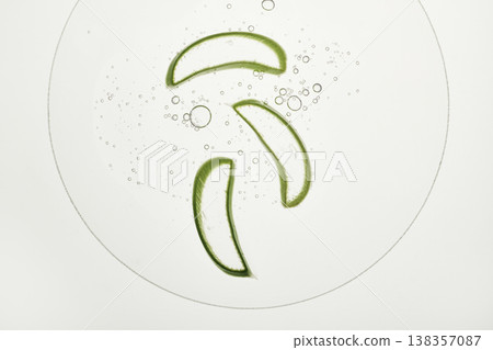 Aloe vera slices floating in transparent skincare gel with many small bubbles Aloe vera slices floating in transparent skincare gel with many small bubbles 138357087