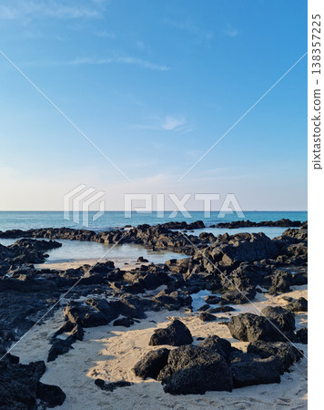 This is a Jeju seascape with basalt rocks. 138357225