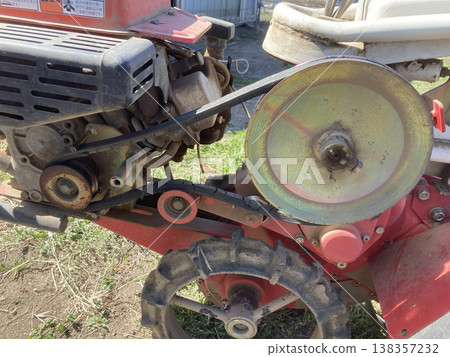 Cracked V-belt and pulley on a tiller - farm equipment maintenance photos Cracked V-belt and pulley on a tiller - farm equipment maintenance photos 138357232