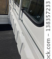 Light truck bed, back of the driver's seat, and white body 138357233