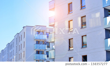 Apartments in residential complex. Housing structure at modern house.  Architecture for property investment. and architecture details. Urban abstract - windows of apartment building. 138357277