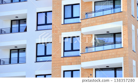 Apartments in residential complex. Housing structure at modern house. Architecture for property investment. and architecture details. Urban abstract - windows of apartment building. Apartments in residential complex. Housing structure at modern house. Architecture for property investment. and architecture details. Urban abstract - windows of apartment building. 138357280