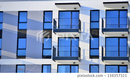 Apartments in residential complex. Housing structure at modern house. Architecture for property investment. and architecture details. Urban abstract - windows of apartment building. Apartments in residential complex. Housing structure at modern house. Architecture for property investment. and architecture details. Urban abstract - windows of apartment building. 138357321