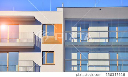 Apartments in residential complex. Housing structure at modern house.  Architecture for property investment. and architecture details. Urban abstract - windows of apartment building. 138357616