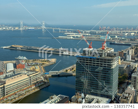 Waterfront view overlooking a building under construction and the Yokohama Bay Bridge. February 18, 2026, Yokohama City, Kanagawa Prefecture. Waterfront view overlooking a building under construction and the Yokohama Bay Bridge. February 18, 2026, Yokohama City, Kanagawa Prefecture. 138357741