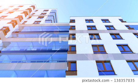 Apartments in residential complex. Housing structure at modern house.  Architecture for property investment. and architecture details. Urban abstract - windows of apartment building. 138357835