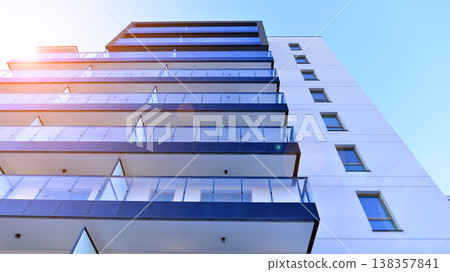 Apartments in residential complex. Housing structure at modern house.  Architecture for property investment. and architecture details. Urban abstract - windows of apartment building. 138357841