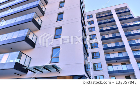 Apartments in residential complex. Housing structure at modern house.  Architecture for property investment. and architecture details. Urban abstract - windows of apartment building. 138357845