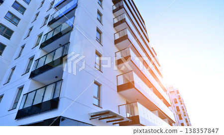 Apartments in residential complex. Housing structure at modern house.  Architecture for property investment. and architecture details. Urban abstract - windows of apartment building. 138357847