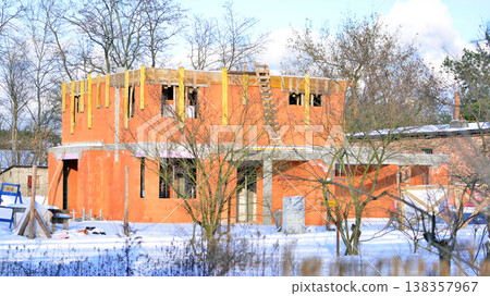 Single family house construction site. Modern designed single-family house under construction. 138357967
