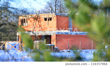 Single family house construction site. Modern designed single-family house under construction. 138357968