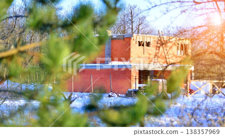 Single family house construction site. Modern designed single-family house under construction. Single family house construction site. Modern designed single-family house under construction. 138357969