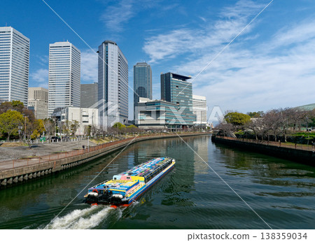 High-rise buildings and a water bus as seen from Shin-Shiginobashi in Osaka Business Park. 138359034