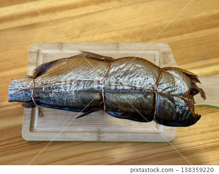 Cold hot smoked mackerel, beautifully laid out on a wooden chopping board, is ready for cooking and serving and is perfect for culinary themes. Cold hot smoked mackerel, beautifully laid out on a wooden chopping board, is ready for cooking and serving and is perfect for culinary themes. 138359220