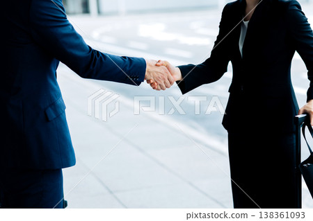 Business greetings, handshake. "Filming assistance: Kansai International Airport (KIX)" 138361093