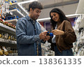 Couple choosing plumbing parts for home renovation project in diy store 138361335