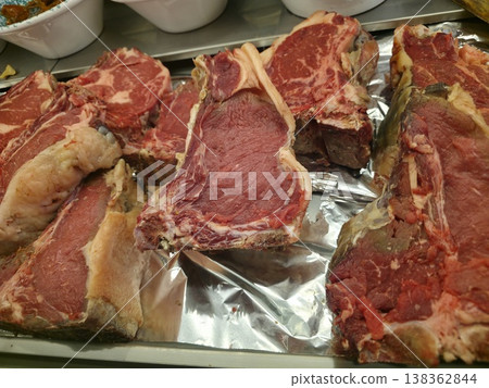 Fiorentina steak beefsteak detail in florence restaurant Fiorentina steak beefsteak detail in florence restaurant 138362844