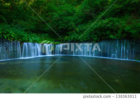 [Karuizawa] The smooth flow of water at Shiraito Falls captured with a slow shutter speed. 138363011