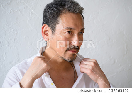 A cool Japanese man against a white background 138363302
