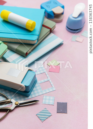 Scrapbooking set creating paper shapes on pink background Scrapbooking set creating paper shapes on pink background 138363745