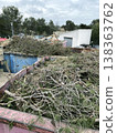 a container overflowing with pruning waste outdoors 138363762