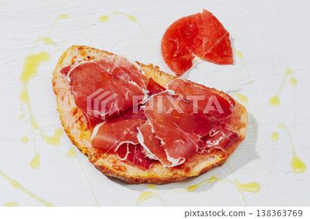 a slice of pa amb tomaquet with ham and tomato a slice of pa amb tomaquet with ham and tomato 138363769