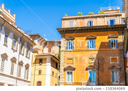 Yellow house facade. Old building architecture in the city center Italy, Rome. Italian balcony windows. Yellow house facade. Old building architecture in the city center Italy, Rome. Italian balcony windows. 138364069