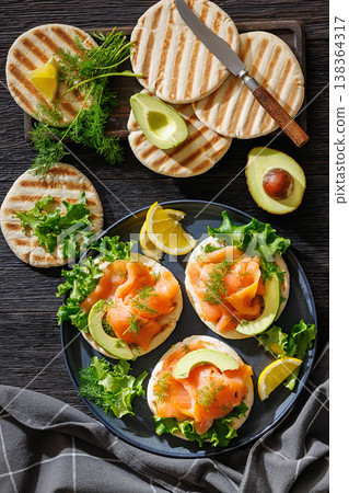 smoked salmon and avocado on grilled pita bread smoked salmon and avocado on grilled pita bread 138364317