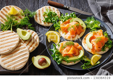 smoked salmon and avocado on grilled pita bread smoked salmon and avocado on grilled pita bread 138364319