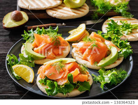 smoked salmon and avocado on grilled pita bread smoked salmon and avocado on grilled pita bread 138364323