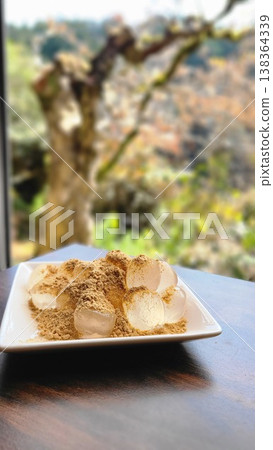 A summer Japanese sweet: Warabi mochi covered in kinako (roasted soybean flour) served on a plate. A summer Japanese sweet: Warabi mochi covered in kinako (roasted soybean flour) served on a plate. 138364339