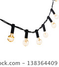 String Lights Hang Above a White Background Creating a Warm Glow in a Casual Setting During Evening Hours 138364409
