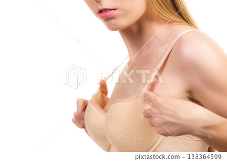Woman wearing too big bra Woman wearing too big bra 138364599