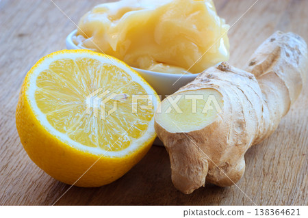ginger root, honey and lemon on wooden rustic table. ginger root, honey and lemon on wooden rustic table. 138364621