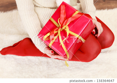 Female hands with red gift box Female hands with red gift box 138364647