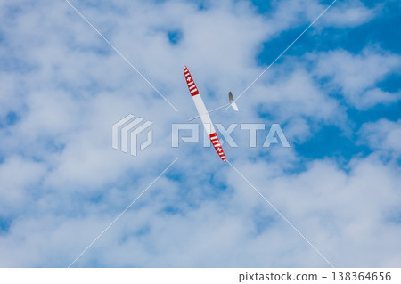 RC soaring plane on blue sky RC soaring plane on blue sky 138364656