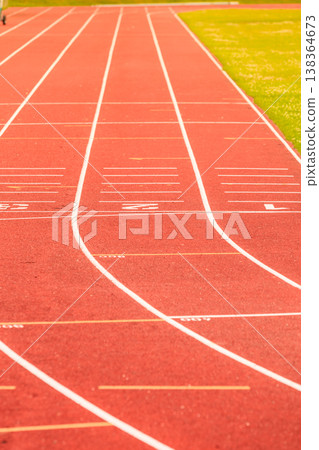 Red running track in stadium. Red running track in stadium. 138364673