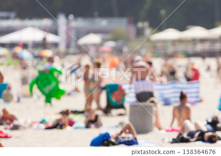 Blurry shot of beach with many people Blurry shot of beach with many people 138364676