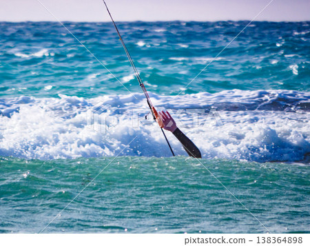 Kite surfer in sea waves. Kiteboarding sport. Kite surfer in sea waves. Kiteboarding sport. 138364898
