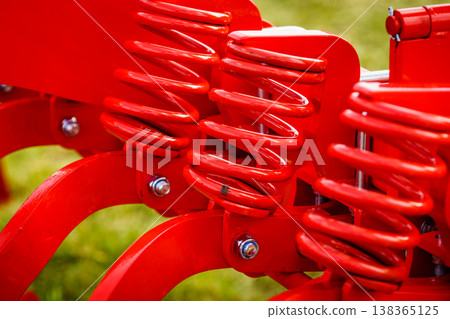 Industrial spring at agricultural machine Industrial spring at agricultural machine 138365125