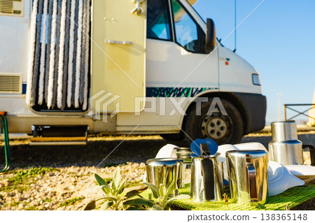 Clean dishes drying on fresh air, capming outdoor Clean dishes drying on fresh air, capming outdoor 138365148
