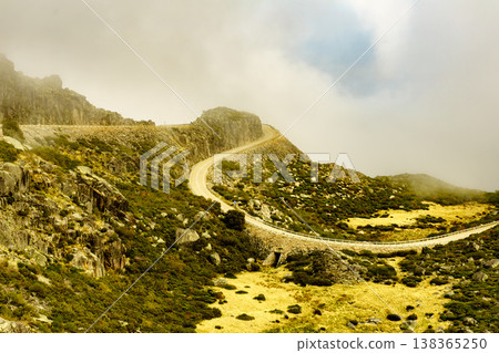 Winding asphalt road in Portugal Winding asphalt road in Portugal 138365250