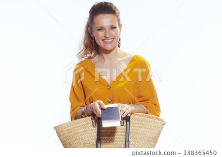 Happy Tourist Holding Passport and Boarding Passes 138365450