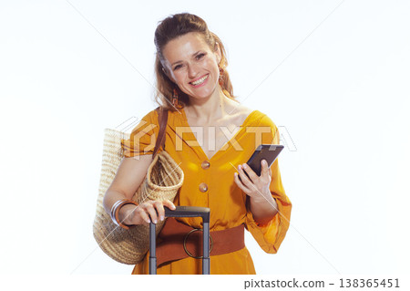 Cheerful Woman Traveler with Smartphone and Suitcase Cheerful Woman Traveler with Smartphone and Suitcase 138365451