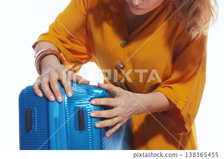 Woman Checking Crushed Suitcase for Travel Insurance 138365455