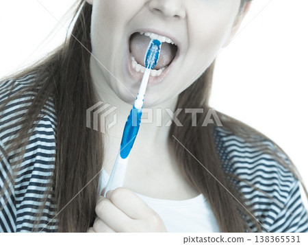 Woman brushing cleaning teeth. Woman brushing cleaning teeth. 138365531
