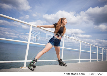 Happy crazy woman wearing roller skates 138365579