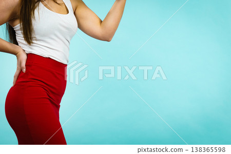 woman presenting outfit red shapely skirt woman presenting outfit red shapely skirt 138365598